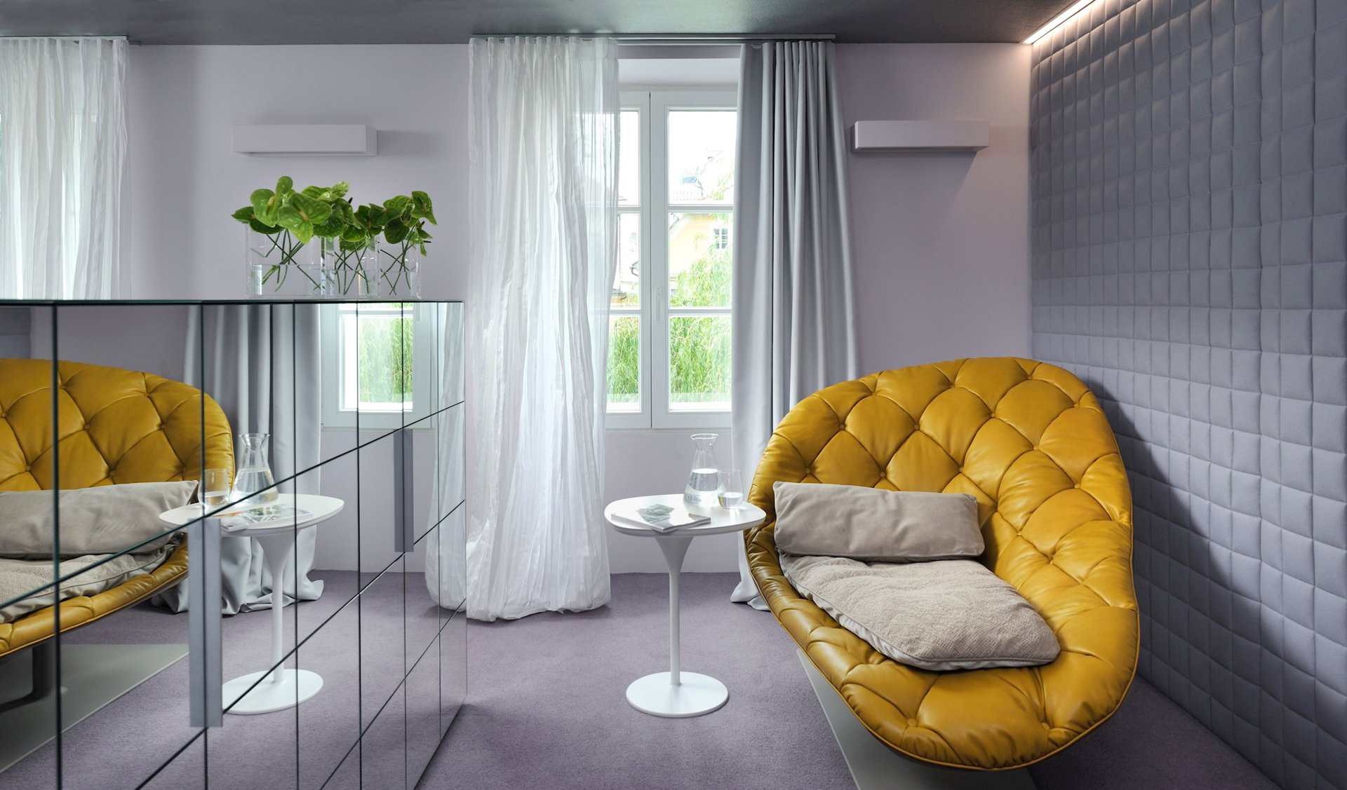 A design room with its signature yellow sofa